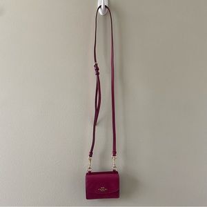 Coach wallet on a chain in pink